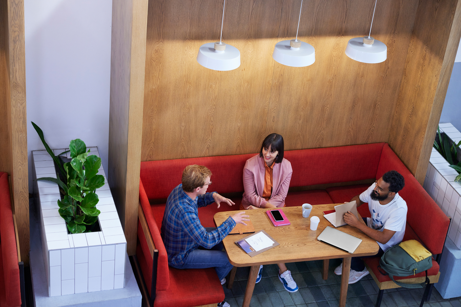 Three people meeting and collaborating